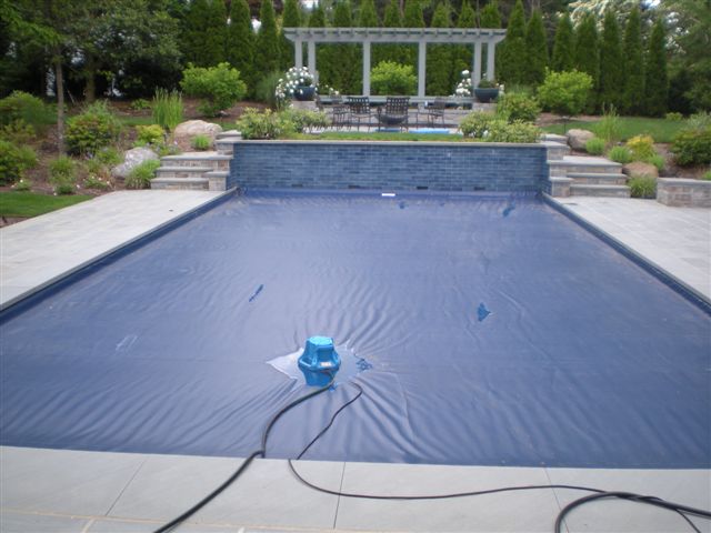 Pool cover pumps